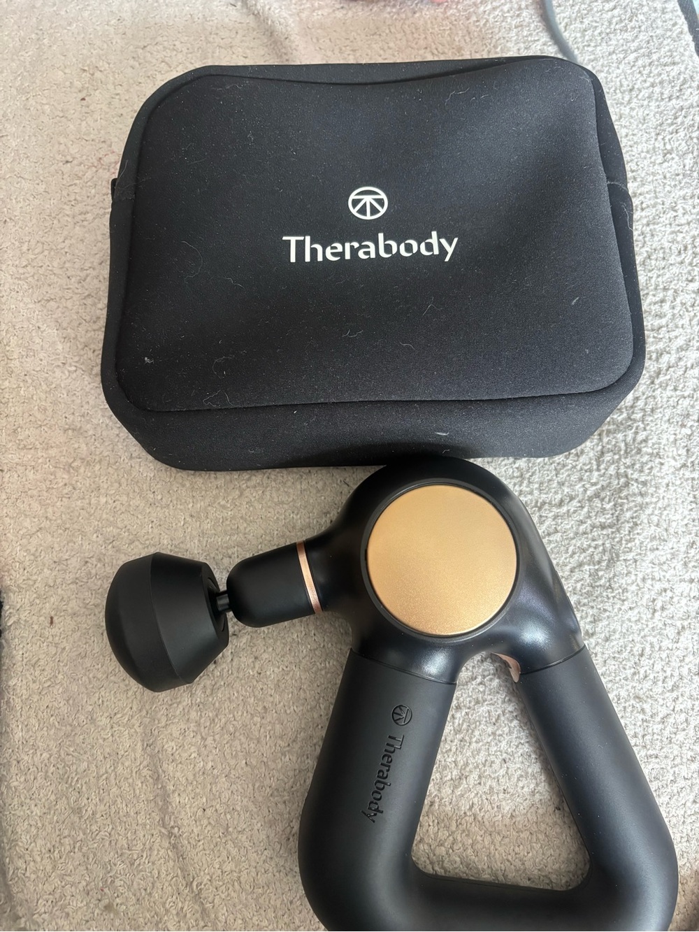 Therabody Black and Gold Triangle Massage Gun with Carrying Case